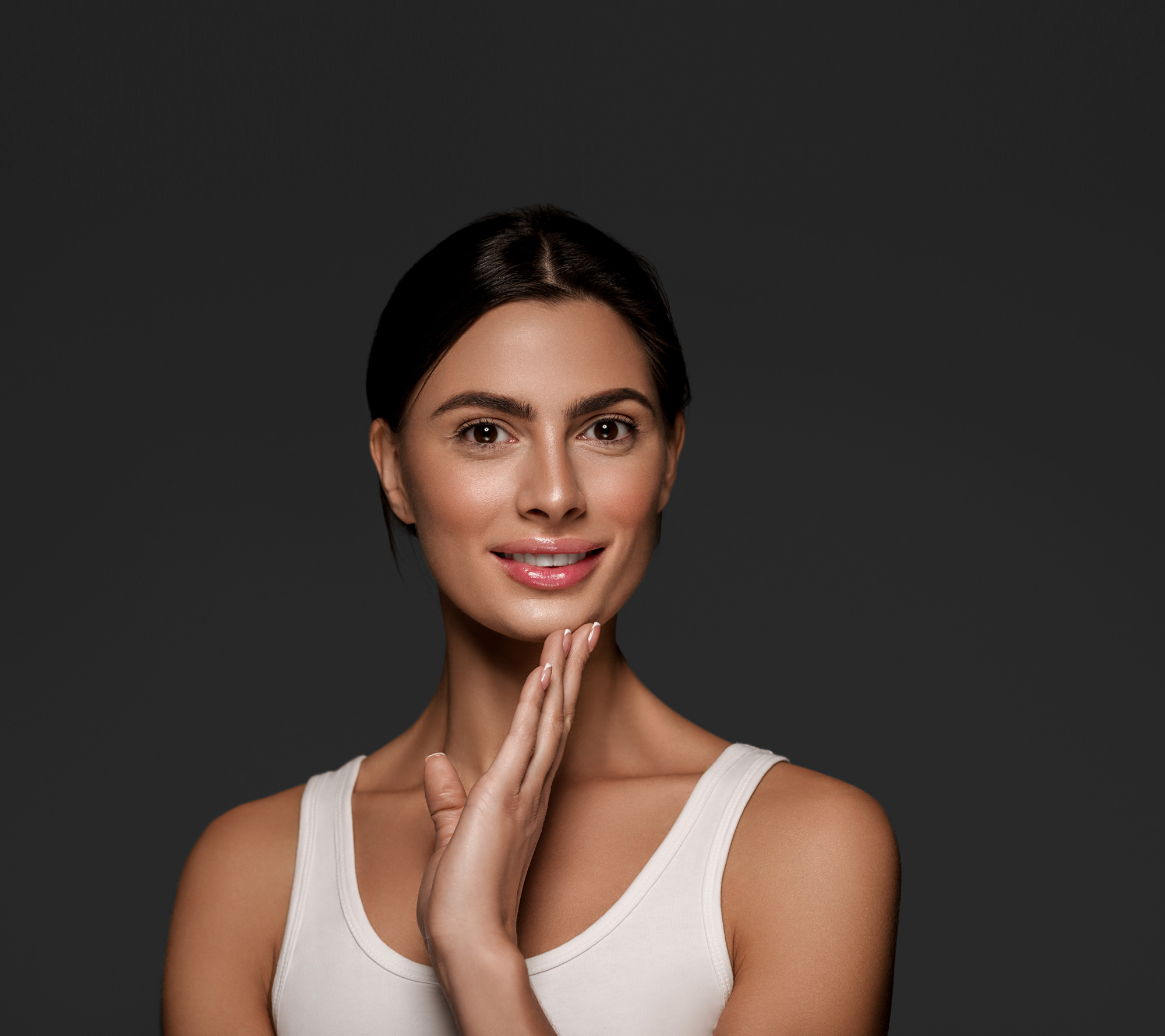 Woman in a white top in a calm wellness pose